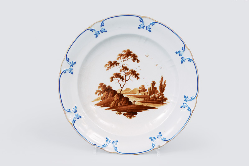 A big plate with river landscape in sepia painting