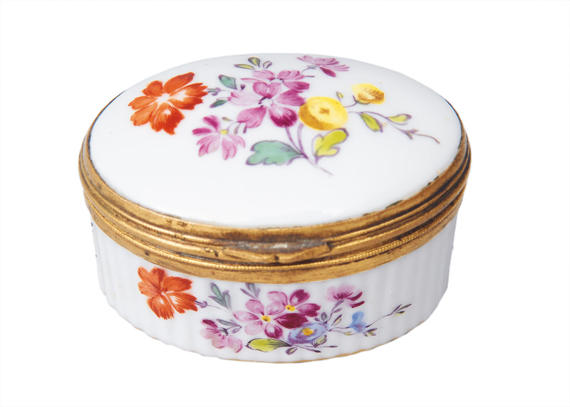 An oval snuff box with flower painting