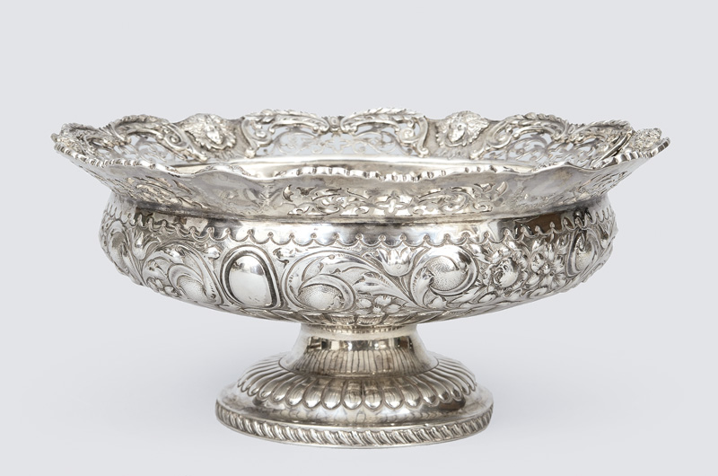 A footed bowl with opulent relief decor