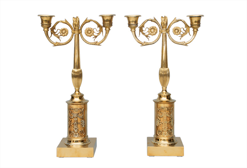 A pair of elegant candle holders in Empire style