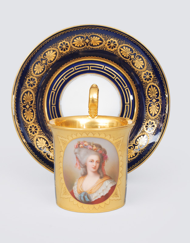 A kobalt blue grounded cup with portrait of a lady