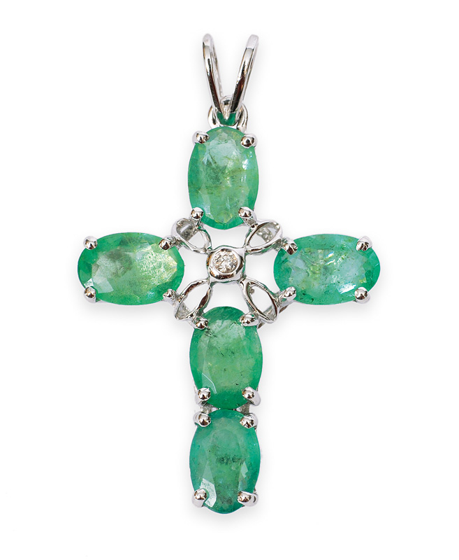 An emerald cross pendant