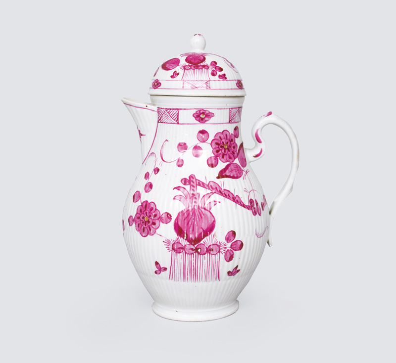 A big coffee pot with crimson painting