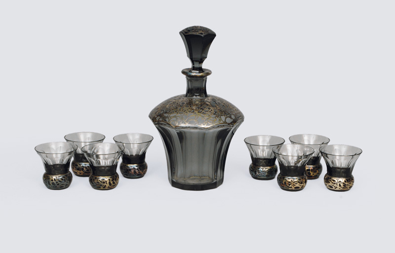 A liqueur set with silver overlay