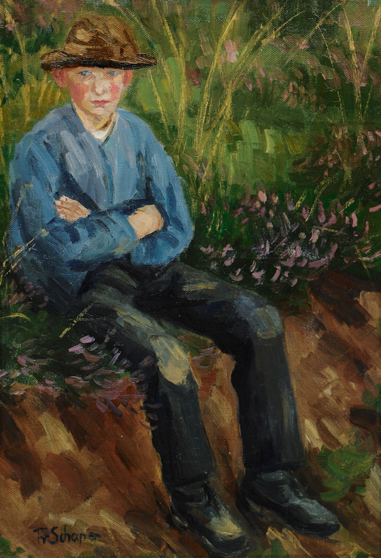 Boy seated on a grassy Bank