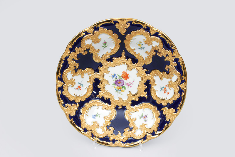 A cobalt blue grounded pompous bowl with flower painting