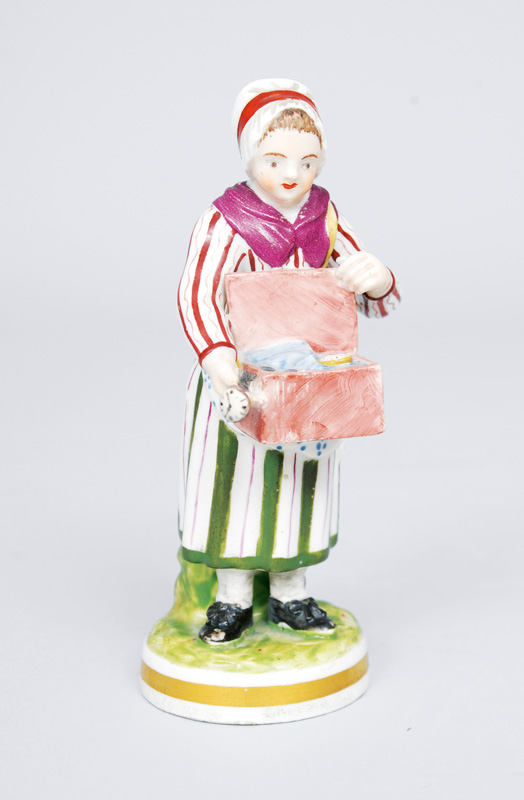 A figurine "Watch dealerwith vendor"s tray"