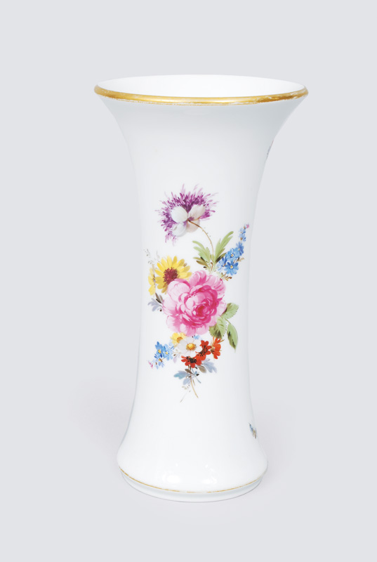 A big vase with bouquets and insects