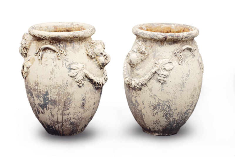 A pair of large cachepots with ornaments of putti