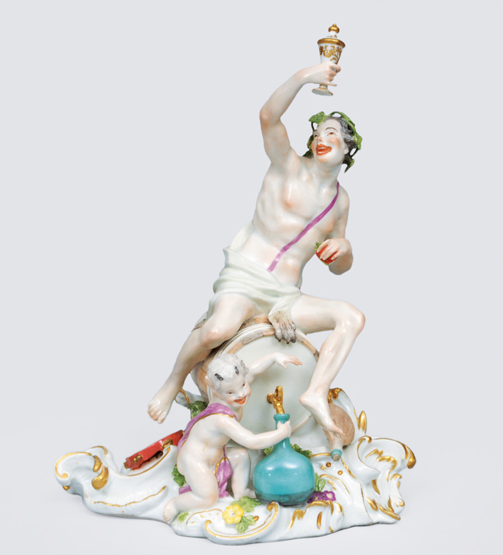 A figurine group "Bacchus with putto" and volute base