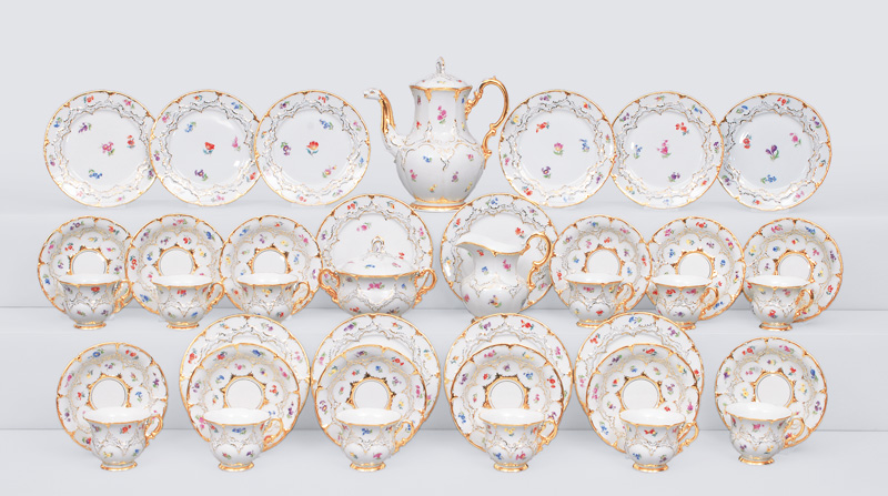 - A pompous coffee service with strewn flowers and gildet rocaille relief for 12 p A pompous coffee service with strewn flowers and gildet rocaille relief for 12 p