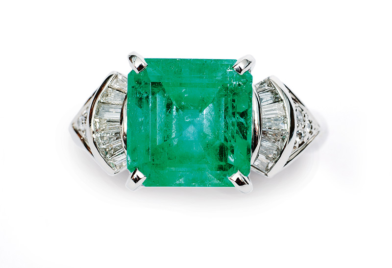 An emerald diamond ring