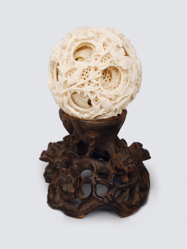 A Chinese devil-work-ball on floral base