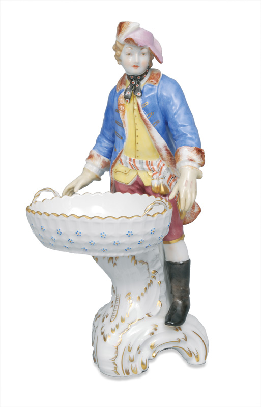 A figurine "Gentle man holding a basket"