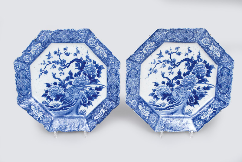 A pair of octogonal plates with blue decoration