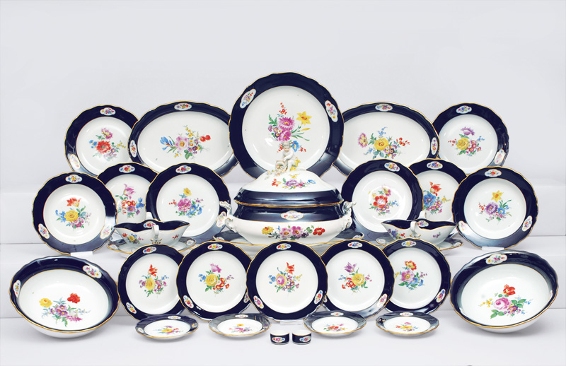 - An extensive dinner service with bouquet and cobalt blue rim for 10 persons An extensive dinner service with bouquet and cobalt blue rim for 10 persons
