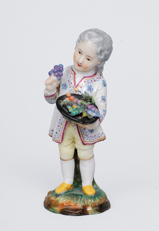 A small figurine "Boy with fruits"