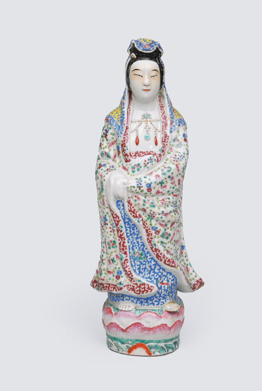 A figurine "Standing Guanyin" on Lotus thron
