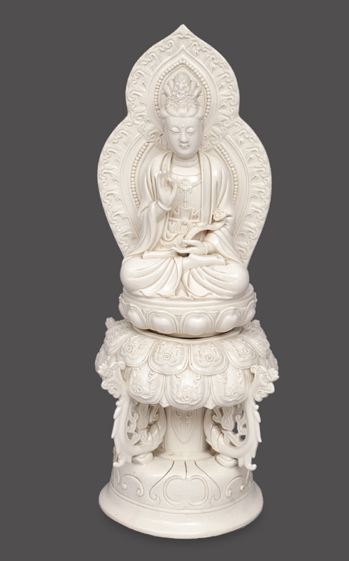 A blance-de-Chine figurine "Guanyin" on rich decorated lotus throne
