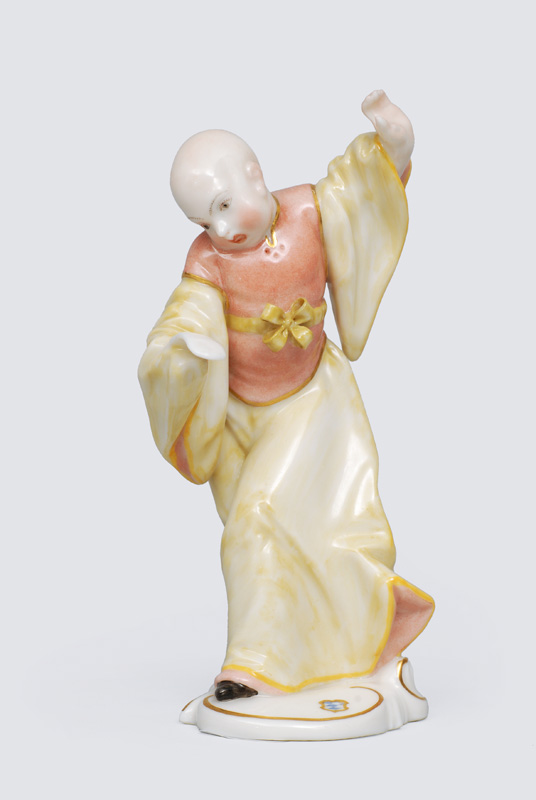 A figurine "Chinese with a sheet of music"