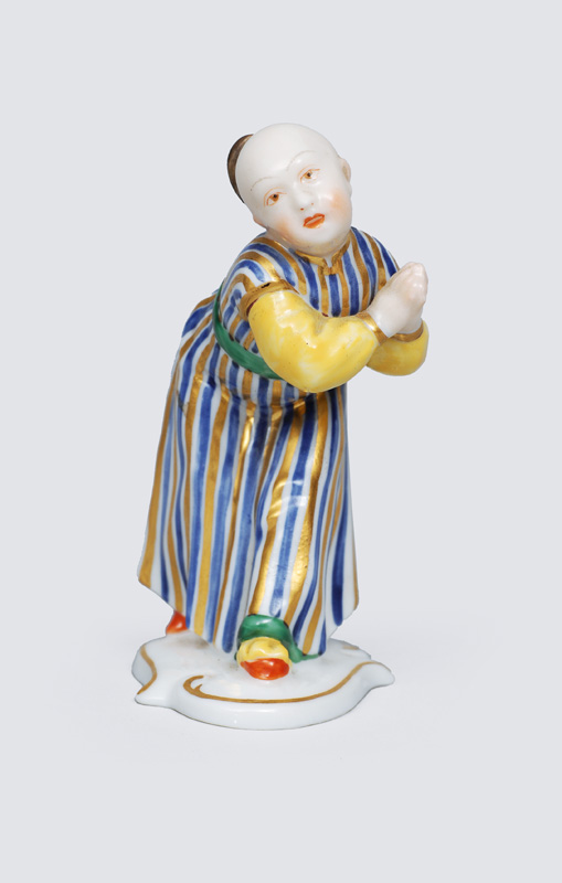 A small figurine "Begging Chinese"