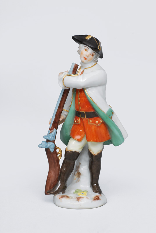A miniature figurine "Hunter with gun"