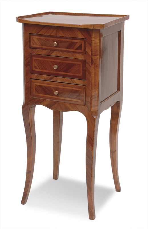 A small chest of drawers in the style of Louis Qunize