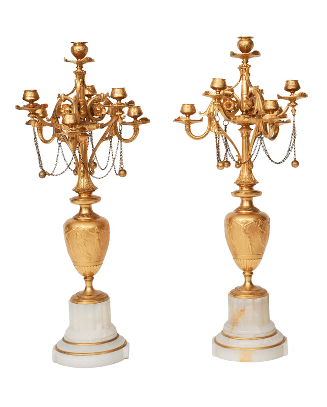 A pair of Napoleon-III candle holders with frieze ornaments