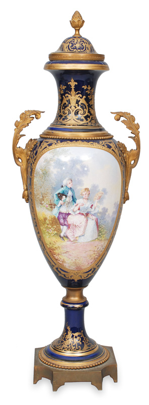 A cobalt blue amphora vase with elegant scene