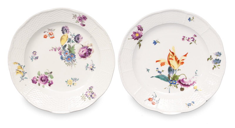 A pair of plates with floral decoration and Ozier relief