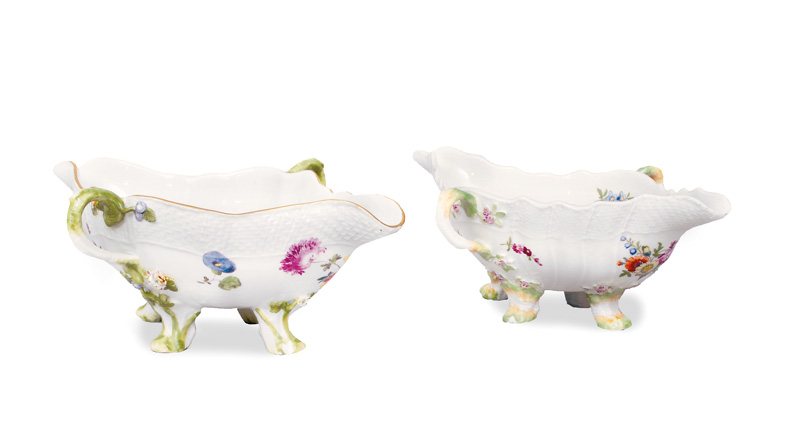 A pair of gravy boats with strewn flowers and Basket rim