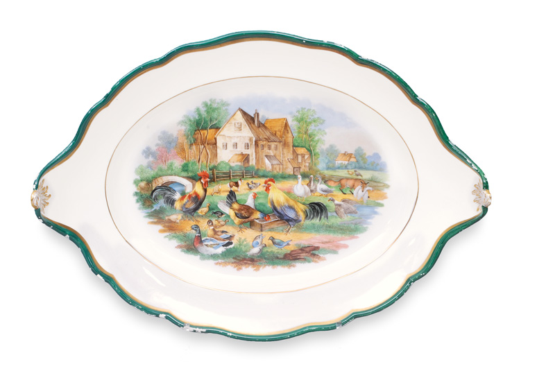 A large oval platter with poultry