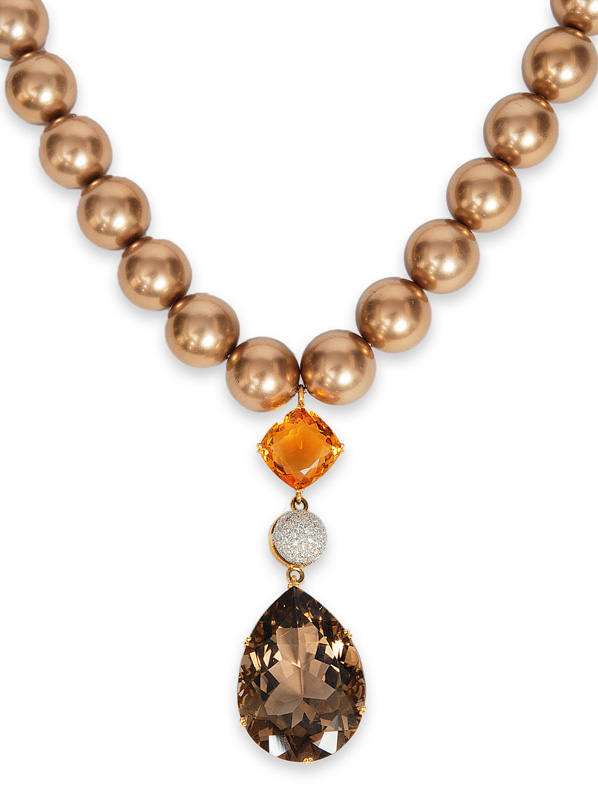 A shell necklace with smoky quartz citrine pendant