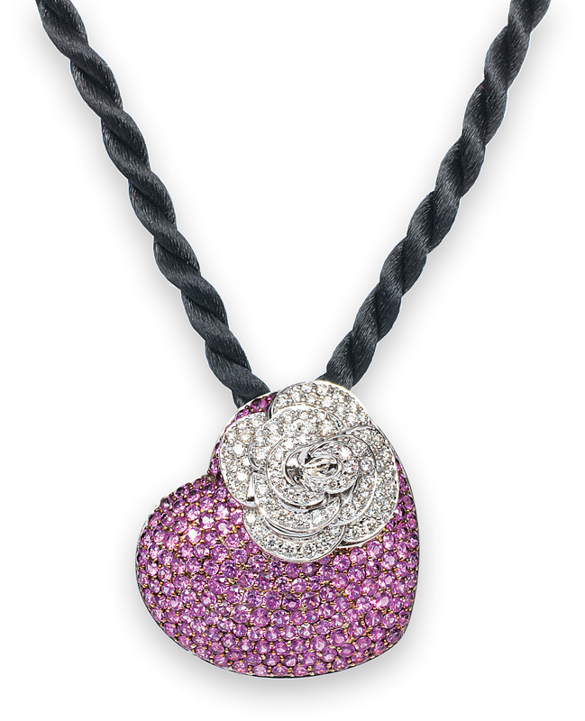 A heartshaped pendant with pink sapphires and diamonds