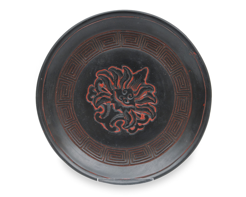 A small black lacquer plate