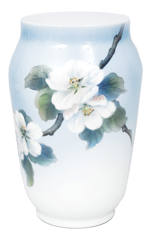 A vase with blooming branches of an apple tree