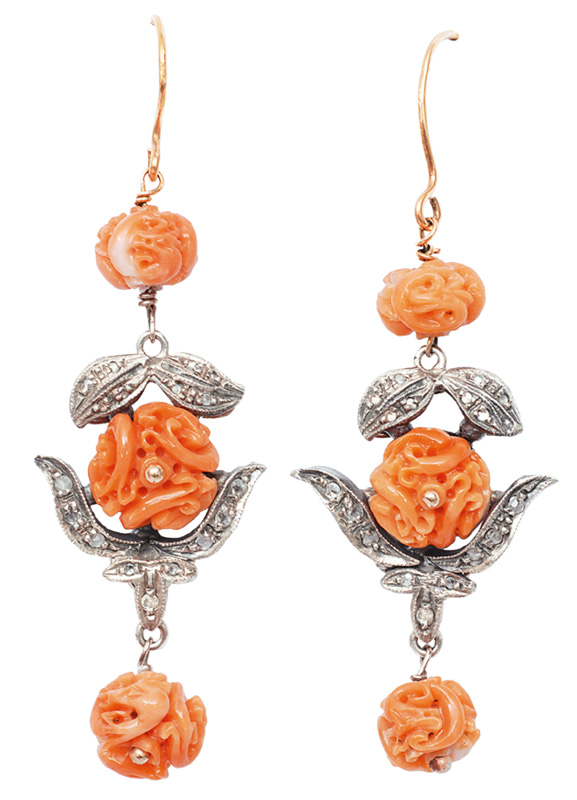 A pair of coral diamond earrings