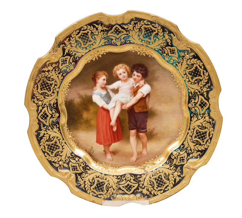 A plate "Children playing" with gilded decor
