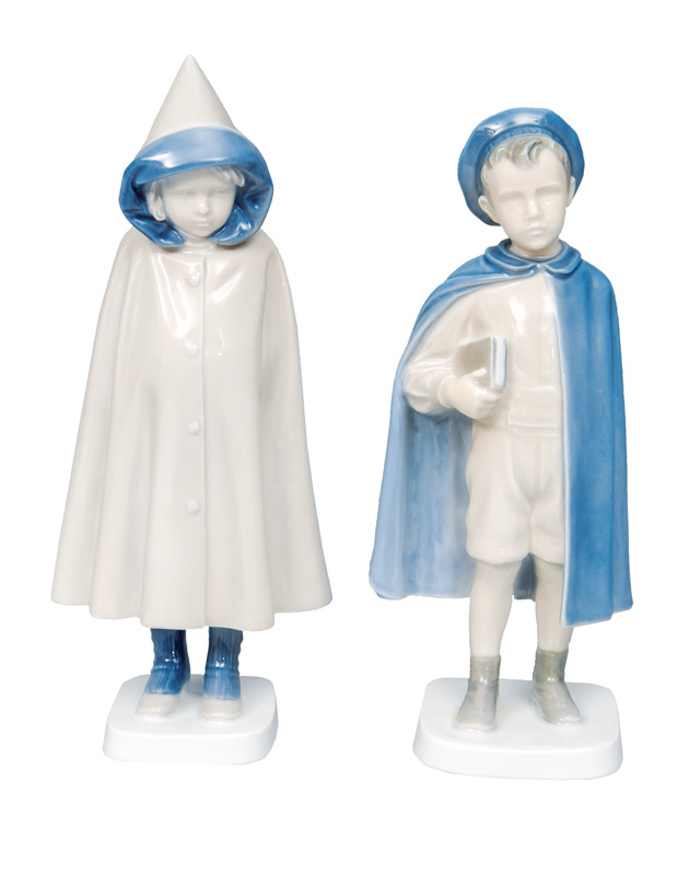 A pair of figurines "Boy with book" and "Girl with raincoat"
