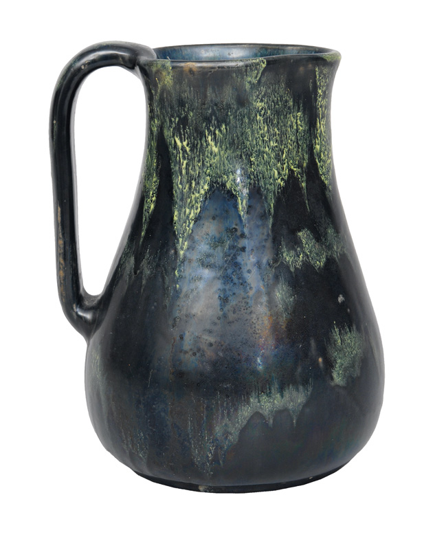 An Art Nouveau carafe with running glaze