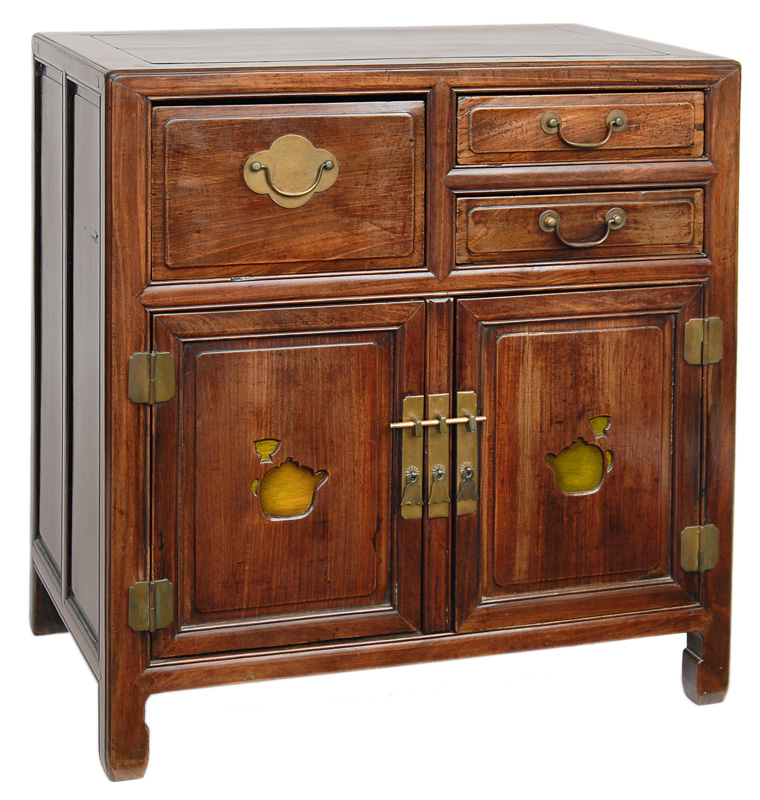 A cabinet with brass mountings