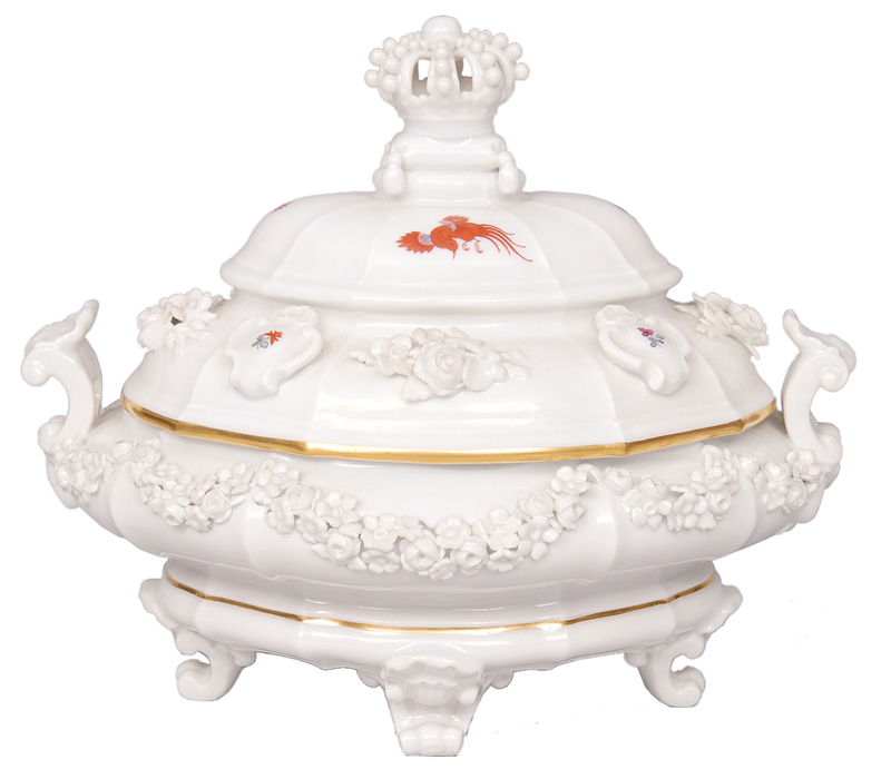 A small tureen with gold rim