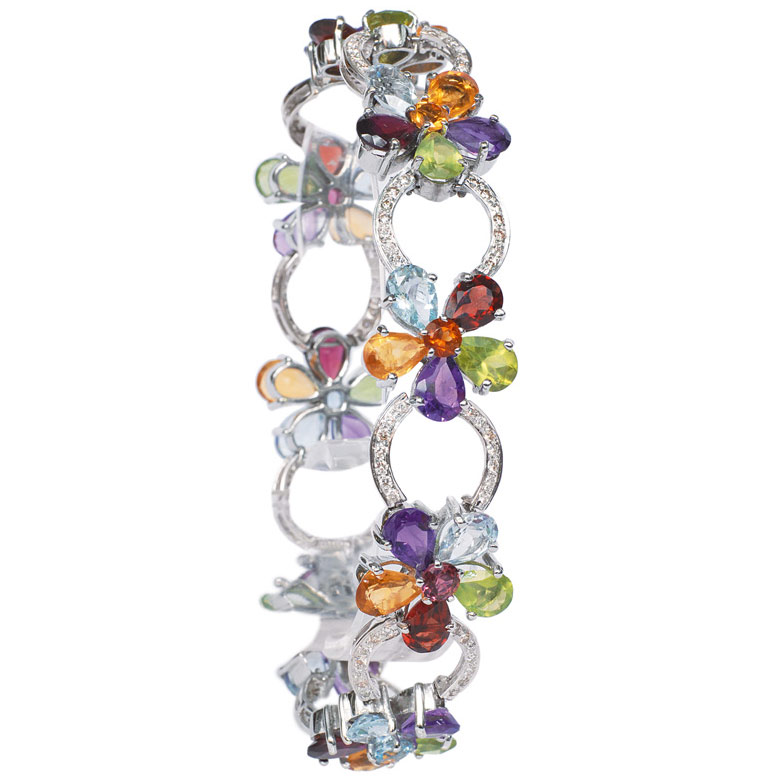 A bracelet rich jewelled with coloured gemstones
