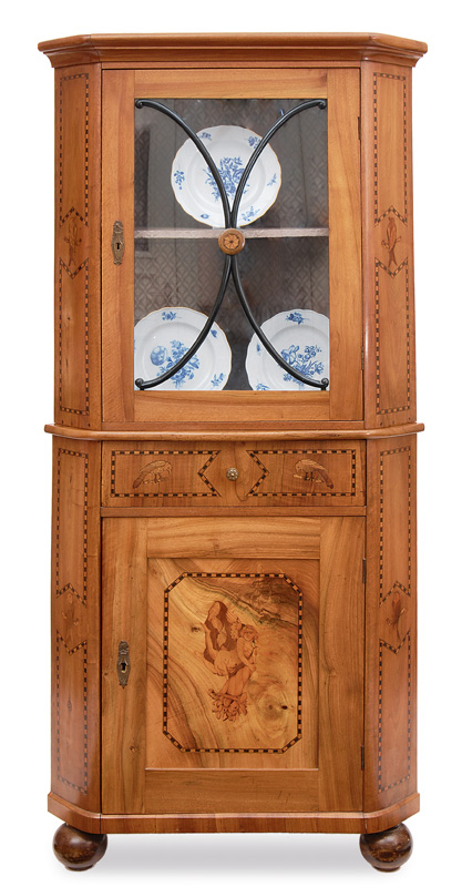 A corner cabinet with inlaid work