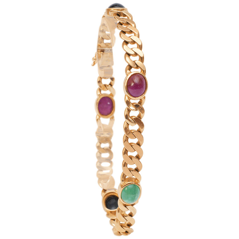 A golden bracelet with sapphire, ruby and emerald