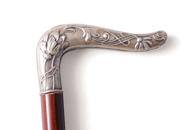 An Art Nouveau walking cane with textured lilies