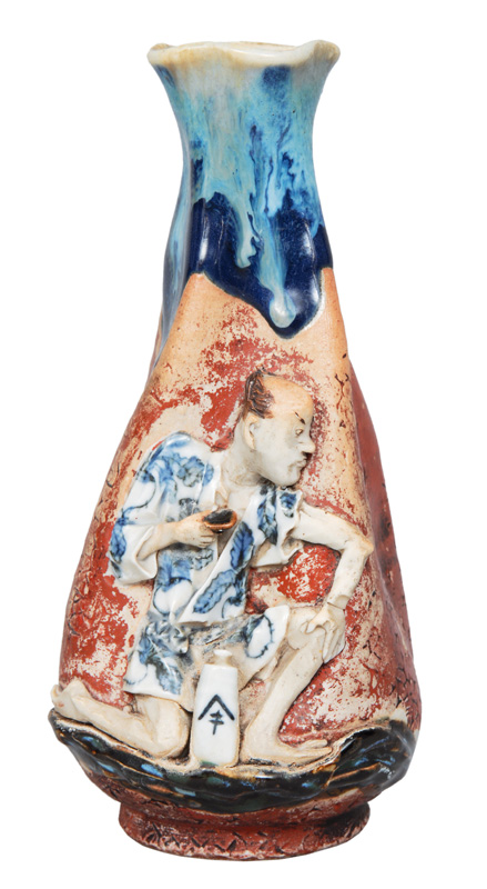 A bottle-shaped vase with figural relief