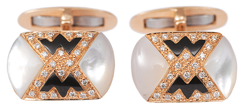 A pair of onyx mother-of-pearl cuff links with diamonds