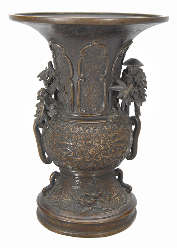 A bronze vase with tiger, huntsman and taotie masks