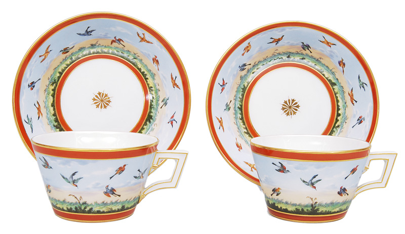 A pair of cups with painting of birds
